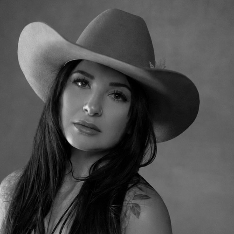 Maddy in a cowgirl hat